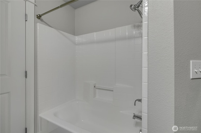 15700 116th Ave NE Unit 205, Bothell, WA 98011 - full bath featuring a textured wall and shower / washtub combination