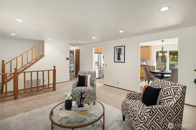 living area with light colored carpet, stairs, recessed lighting, baseboards, and visible vents