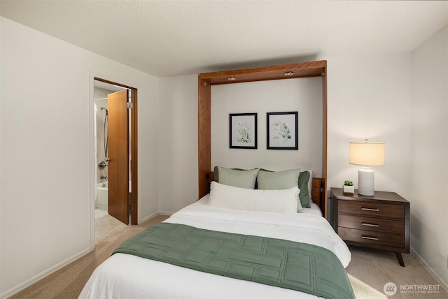 bedroom with light colored carpet and baseboards