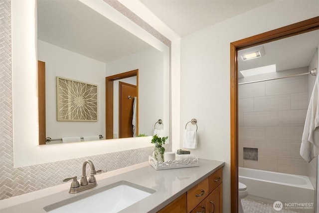 full bathroom with vanity, tub / shower combination, and toilet