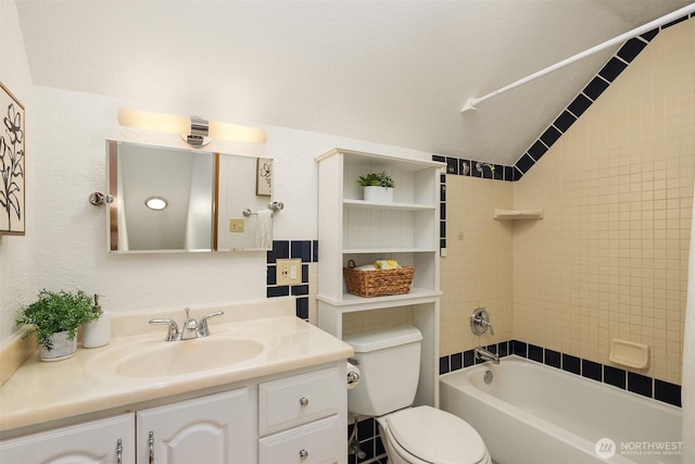 bathroom with vanity, shower / bathtub combination, and toilet