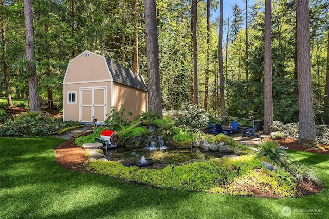 view of shed with a garden pond