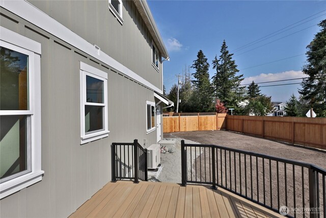 wooden terrace featuring a fenced backyard and a patio area