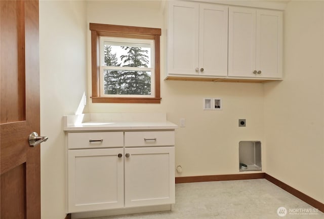 laundry area featuring cabinet space, hookup for a washing machine, baseboards, and electric dryer hookup