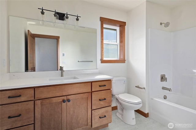 full bathroom with toilet, vanity, bathtub / shower combination, and baseboards