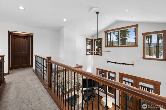 corridor featuring recessed lighting, baseboards, an upstairs landing, and vaulted ceiling