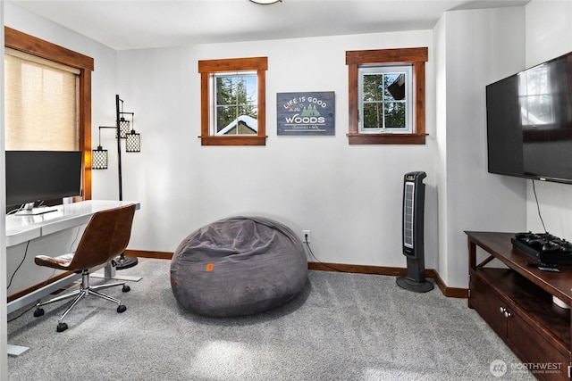 home office featuring baseboards and carpet