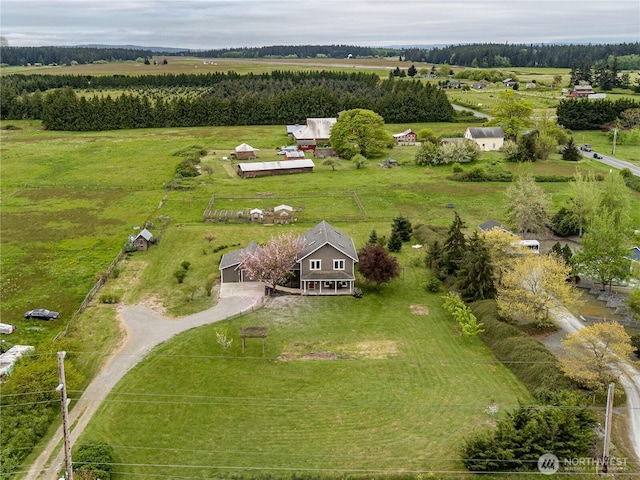 birds eye view of property with a rural view