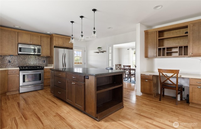 kitchen featuring open shelves, appliances with stainless steel finishes, tasteful backsplash, and light wood-type flooring