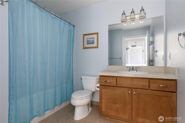 full bathroom featuring a shower with curtain, tile patterned floors, vanity, and toilet