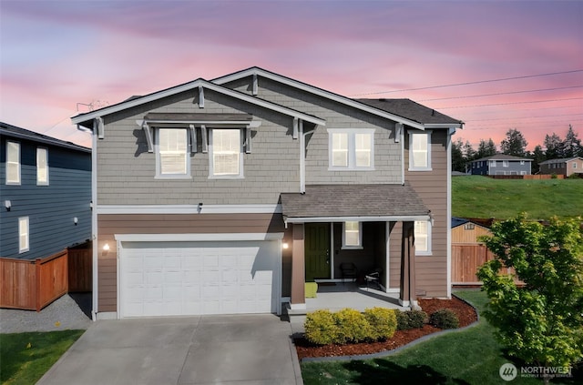 view of front of property featuring a porch, an attached garage, fence, and concrete driveway