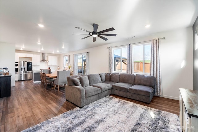 living room with recessed lighting, baseboards, ceiling fan, and dark wood-style flooring