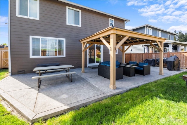 view of patio / terrace with area for grilling, a gazebo, fence, and an outdoor hangout area