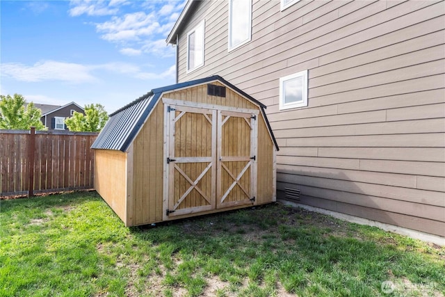 view of shed with fence