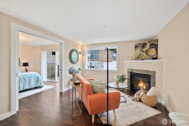 107 20th Ave Unit 306, Seattle, WA 98122 - living room with a tile fireplace, plenty of natural light, and dark wood-style flooring