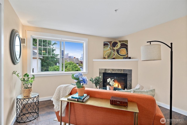 107 20th Ave Unit 306, Seattle, WA 98122 - living area featuring a glass covered fireplace, wood finished floors, and baseboards