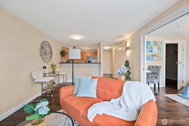 107 20th Ave Unit 306, Seattle, WA 98122 - living room featuring baseboards and wood finished floors