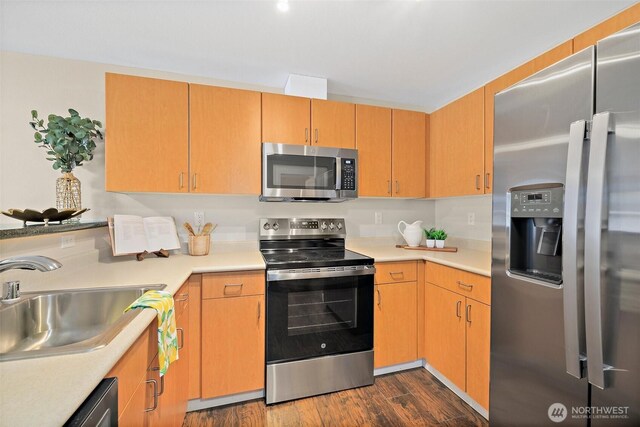 107 20th Ave Unit 306, Seattle, WA 98122 - kitchen featuring appliances with stainless steel finishes, a sink, light countertops, and dark wood-type flooring