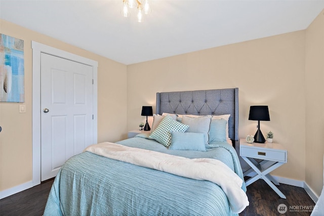 107 20th Ave Unit 306, Seattle, WA 98122 - bedroom with baseboards and wood finished floors