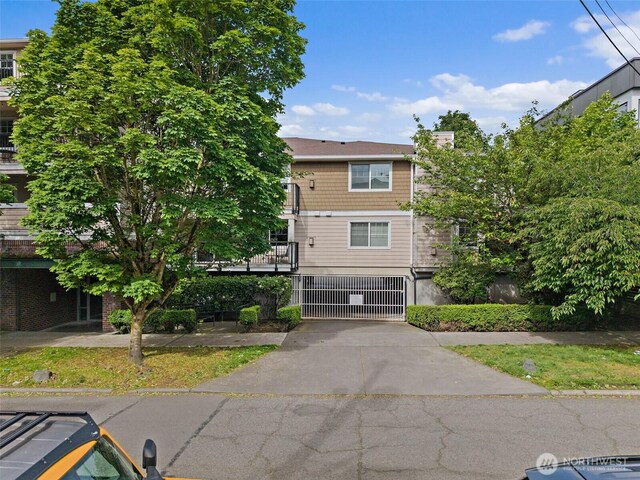 107 20th Ave Unit 306, Seattle, WA 98122 - view of front of property with concrete driveway