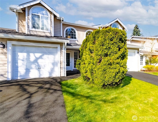 6049 Merlot Ln SE, Lacey, WA 98513 - view of front facade with an attached garage, a front lawn, and driveway