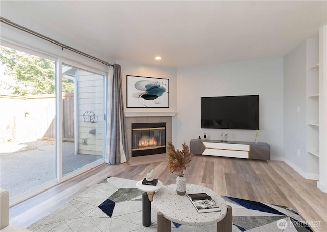 6049 Merlot Ln SE, Lacey, WA 98513 - living area featuring baseboards, a fireplace, recessed lighting, and wood finished floors