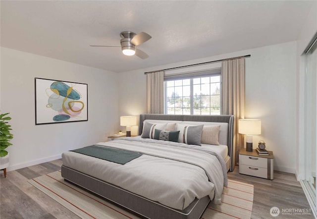 6049 Merlot Ln SE, Lacey, WA 98513 - bedroom featuring baseboards, ceiling fan, and wood finished floors
