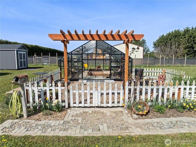 exterior space with an outdoor structure, a storage unit, and fence