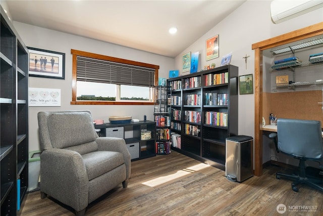 sitting room with recessed lighting, vaulted ceiling, wood finished floors, and a wall unit AC