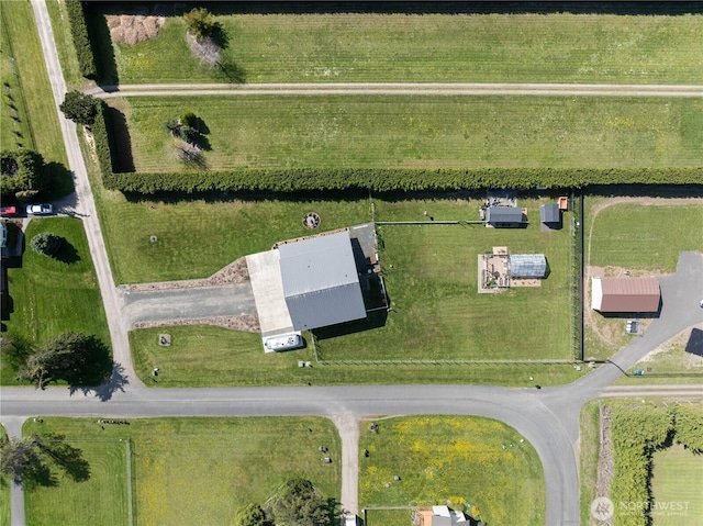 birds eye view of property with a rural view