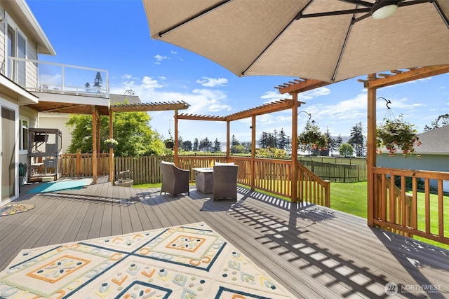 664 Lactrup Spur Ln, Camano Island, WA 98282 - deck featuring a fenced backyard, a pergola, a yard, and outdoor dining space