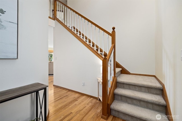 664 Lactrup Spur Ln, Camano Island, WA 98282 - staircase featuring baseboards and wood finished floors