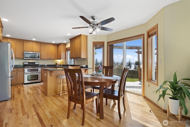 664 Lactrup Spur Ln, Camano Island, WA 98282 - dining space with light wood-style floors, baseboards, a ceiling fan, and recessed lighting