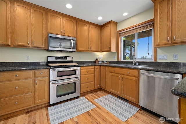 664 Lactrup Spur Ln, Camano Island, WA 98282 - kitchen with a sink, recessed lighting, stainless steel appliances, and light wood-type flooring