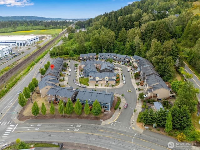 aerial overview of property's location featuring a forest