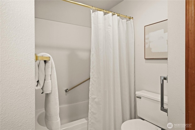 full bathroom featuring toilet
