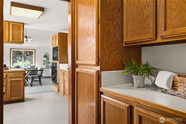 laundry room featuring light carpet and laundry area