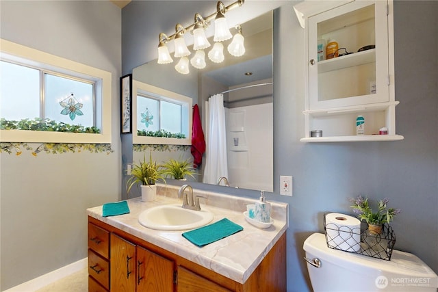 138 SE 5th Ave, Milton-Freewater, OR 97862 - full bath featuring healthy amount of natural light, toilet, vanity, and a shower with curtain
