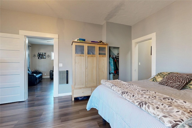 138 SE 5th Ave, Milton-Freewater, OR 97862 - bedroom featuring dark wood-style floors, a closet, and baseboards