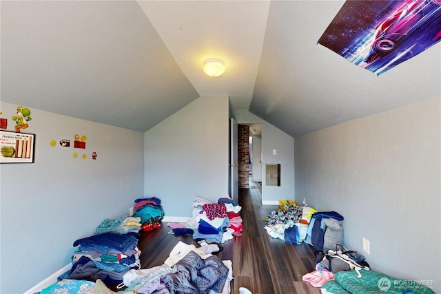138 SE 5th Ave, Milton-Freewater, OR 97862 - bedroom featuring wood finished floors, lofted ceiling, and baseboards