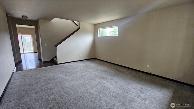 704 7th Ave SW, Tumwater, WA 98512 - carpeted empty room with stairs and baseboards