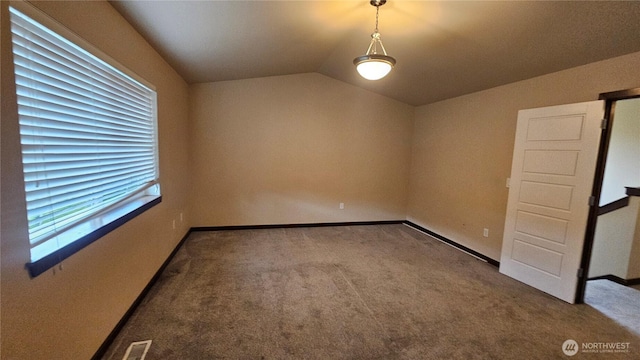 704 7th Ave SW, Tumwater, WA 98512 - carpeted empty room featuring vaulted ceiling and baseboards