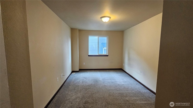 704 7th Ave SW, Tumwater, WA 98512 - carpeted spare room featuring baseboards