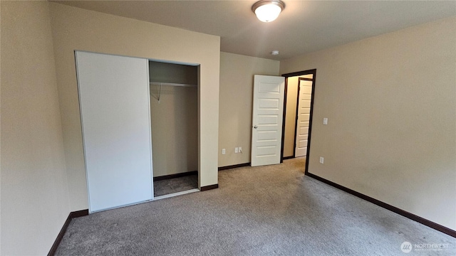704 7th Ave SW, Tumwater, WA 98512 - unfurnished bedroom with carpet floors, baseboards, and a closet