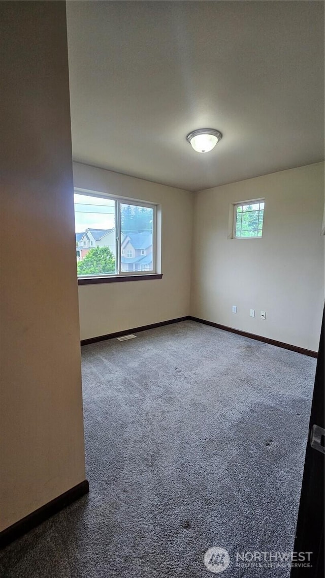 704 7th Ave SW, Tumwater, WA 98512 - spare room with baseboards and carpet flooring