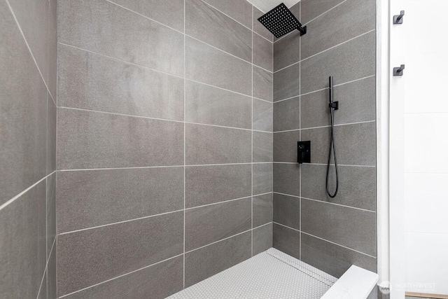 bathroom with a tile shower
