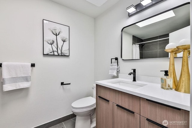 bathroom with tile patterned floors, vanity, baseboards, toilet, and a shower with shower curtain