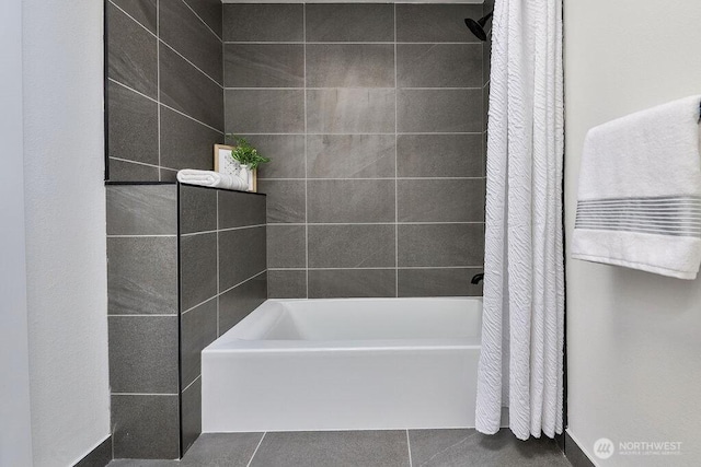 bathroom featuring shower / bath combo and tile patterned floors