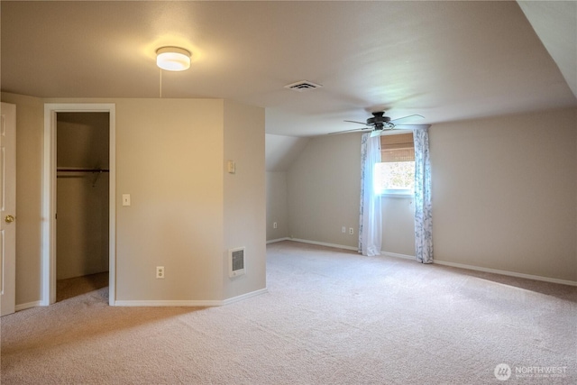 bonus room featuring visible vents, ceiling fan, and light colored carpet