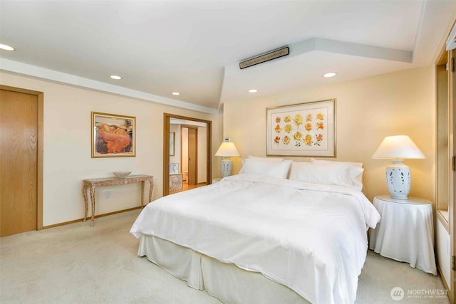 bedroom with light carpet, recessed lighting, and baseboards